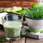 Green pear sprouts, fresh vegetables and smoothie for healthy and delicious  full of vitamins meal.   Dairy smoothie with micro greens  and vegetables ready to eat